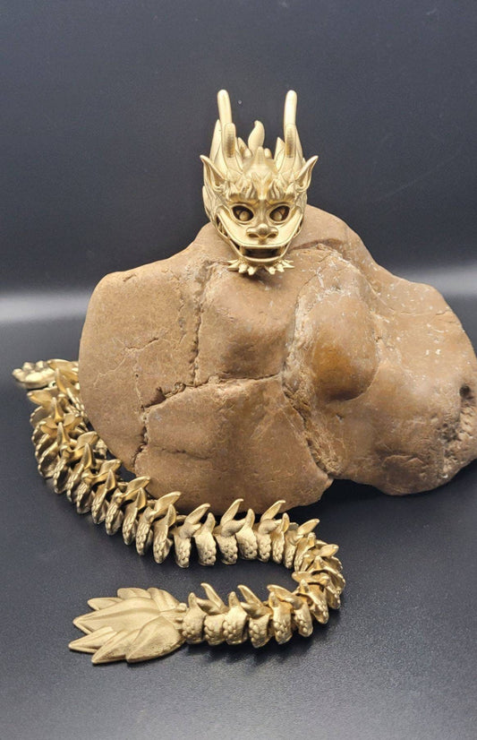 Resin 3D articulate dragon fidget toy.