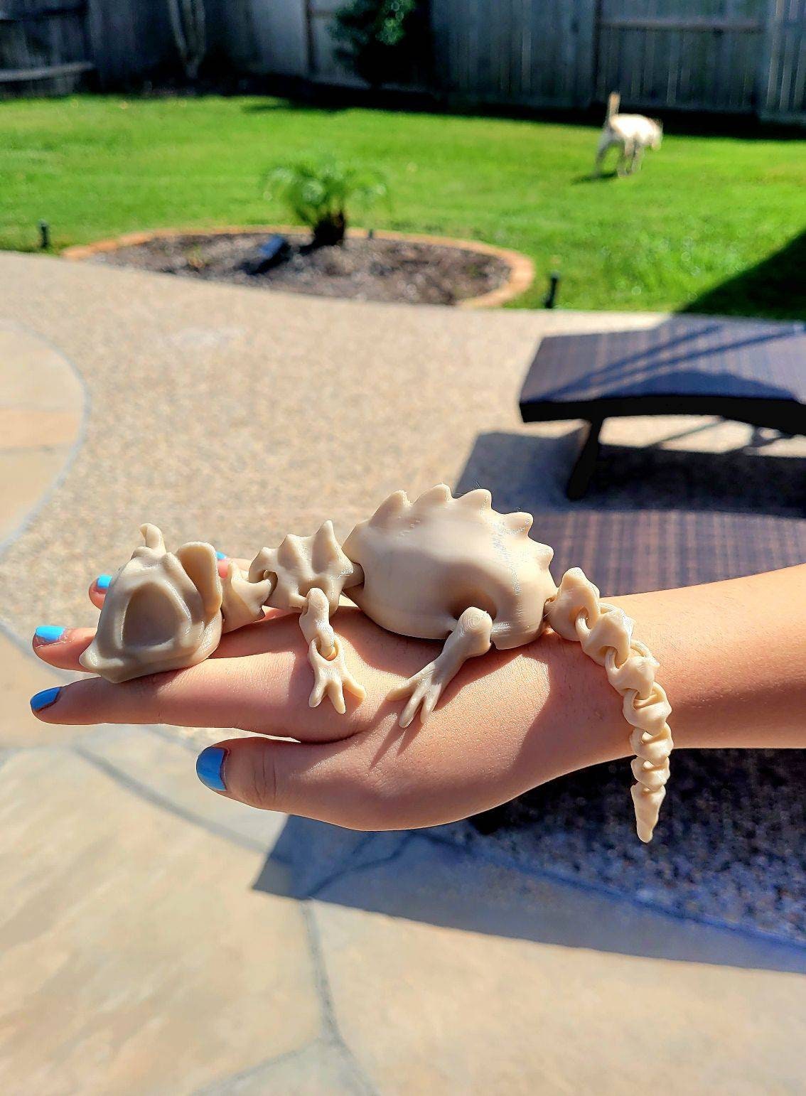 3D printed bone rat, articulated fidget toy.