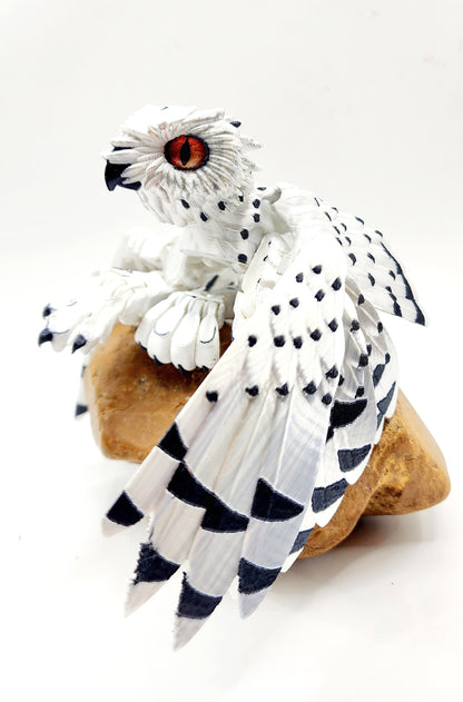 3D printed articulated Snow Gryphon fidget desk toy.