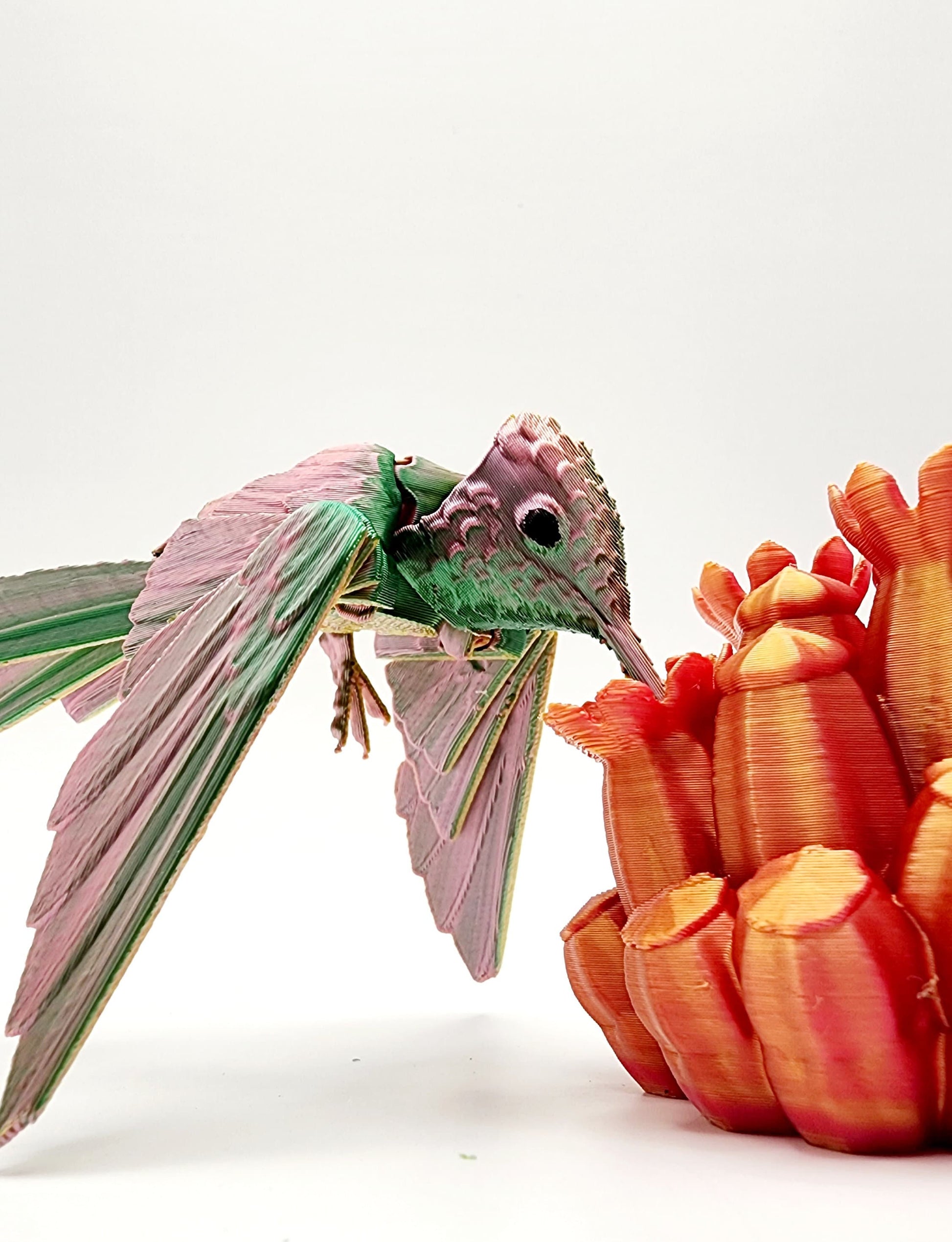 3D printed Humming Bird with a floral stand articulated fidget sensory toy. Desk Toy.