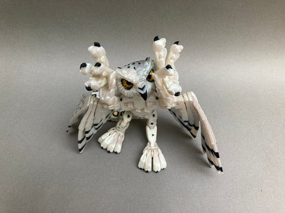 3D printed articulated Snow Gryphon fidget desk toy.