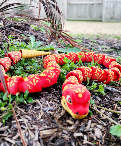 3D printed articulate Year of the Snake fidget, sensory toy.