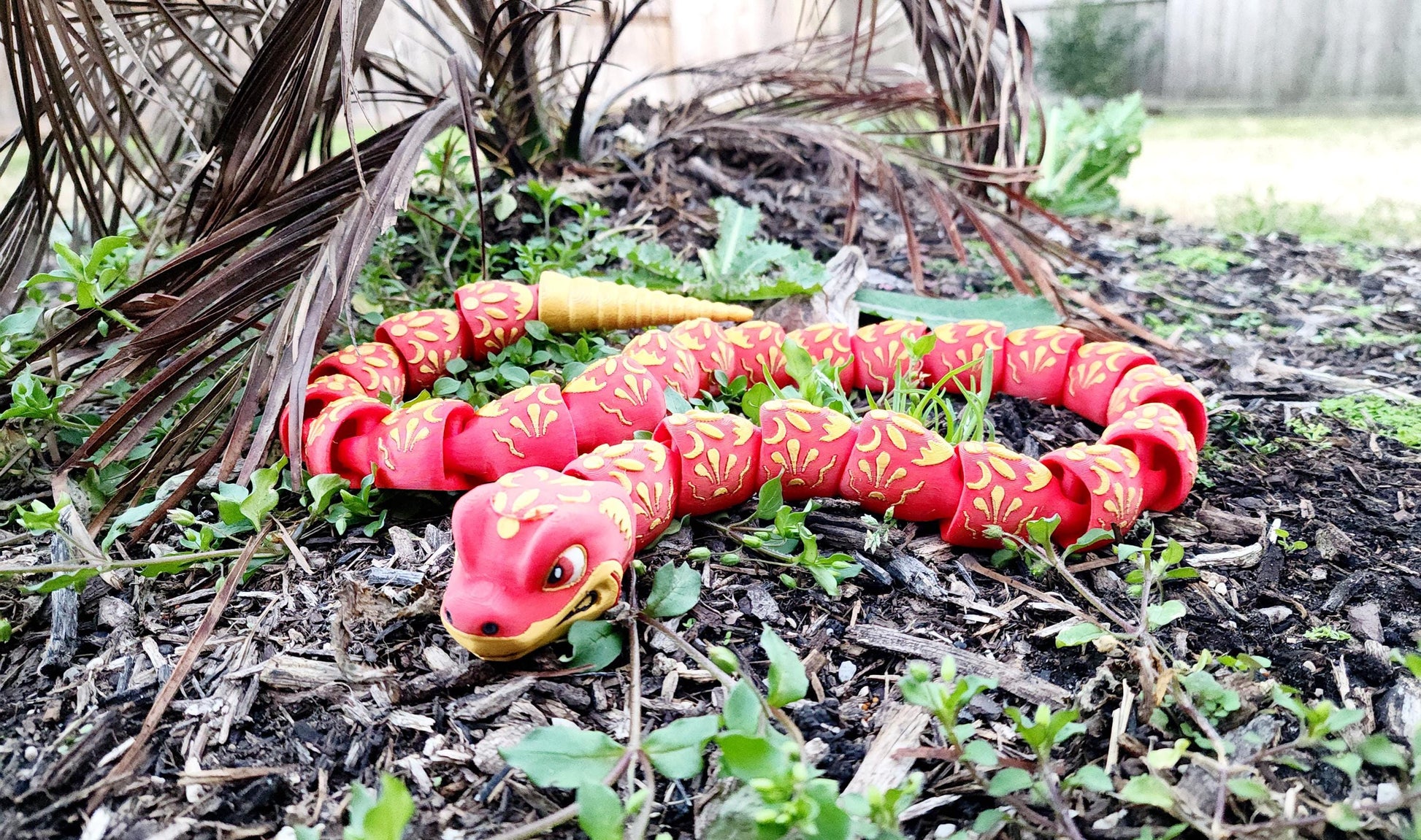 3D printed articulate Year of the Snake fidget, sensory toy.