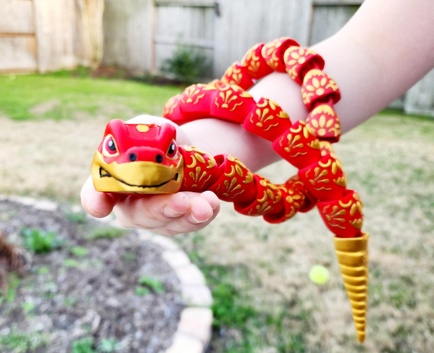 3D printed articulate Year of the Snake fidget, sensory toy.