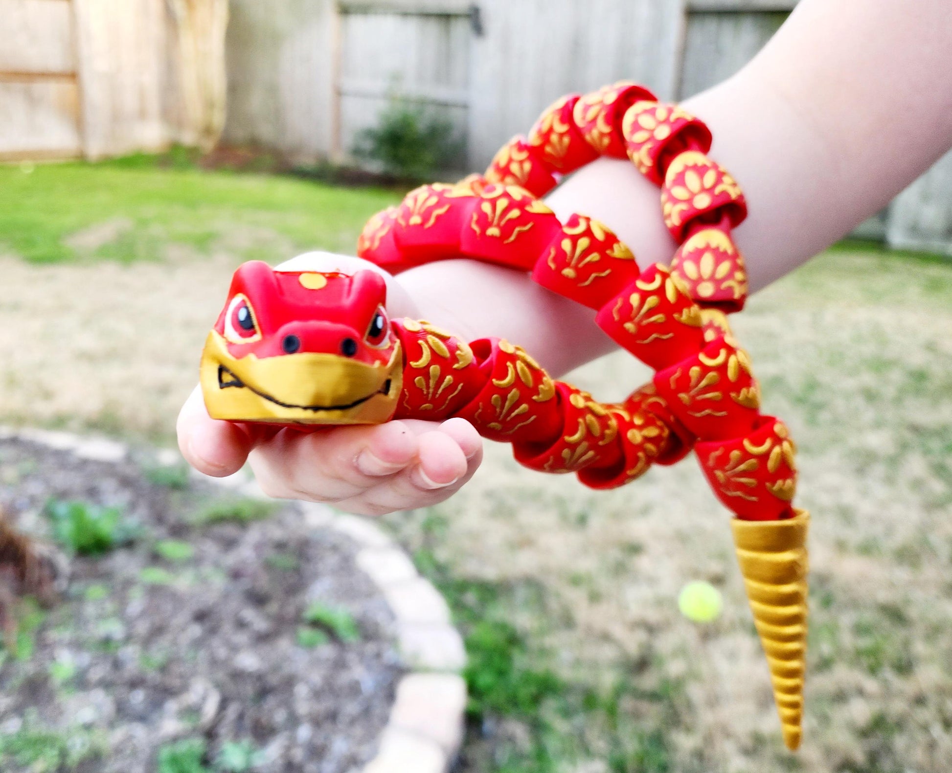 3D printed articulate Year of the Snake fidget, sensory toy.