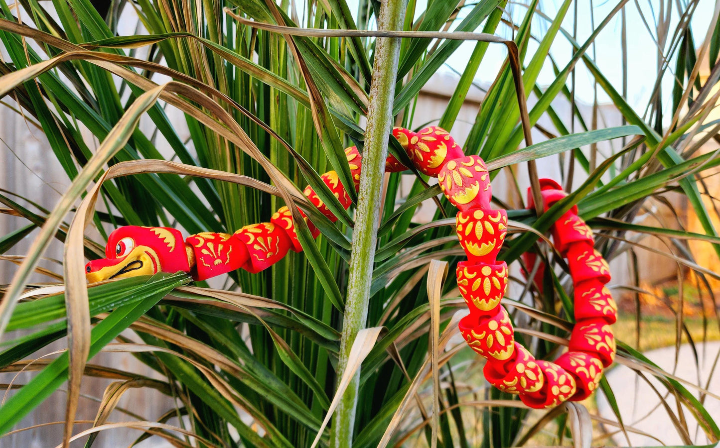 3D printed articulate Year of the Snake fidget, sensory toy.