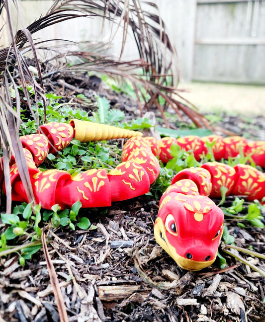 3D printed articulate Year of the Snake fidget, sensory toy.