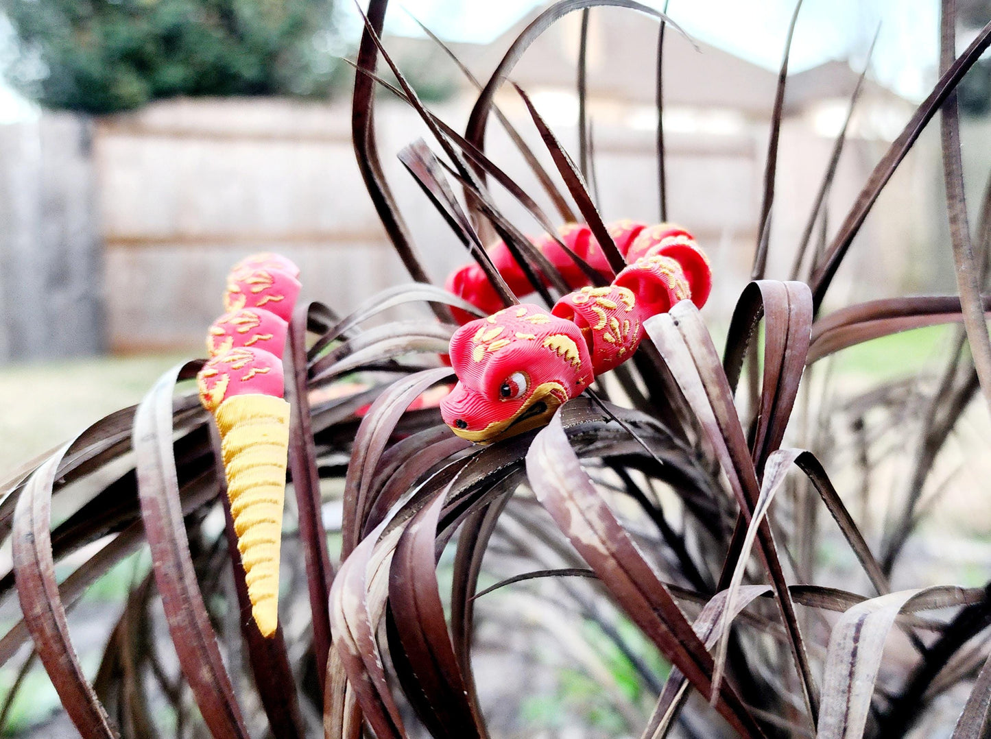 3D printed articulate Year of the Snake fidget, sensory toy.