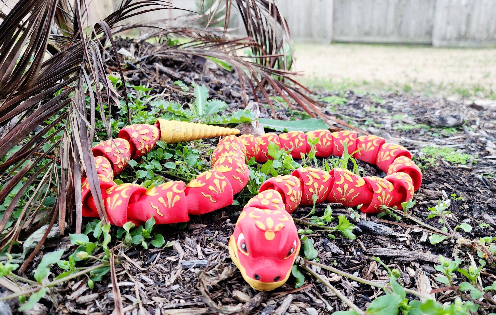 3D printed articulate Year of the Snake fidget, sensory toy.