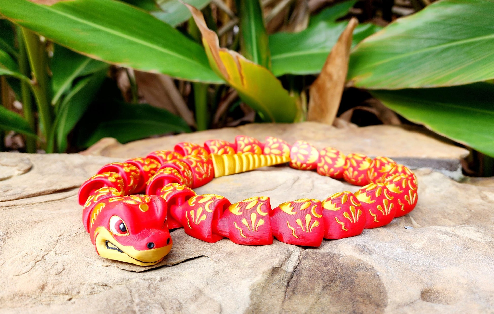 3D printed articulate Year of the Snake fidget, sensory toy.