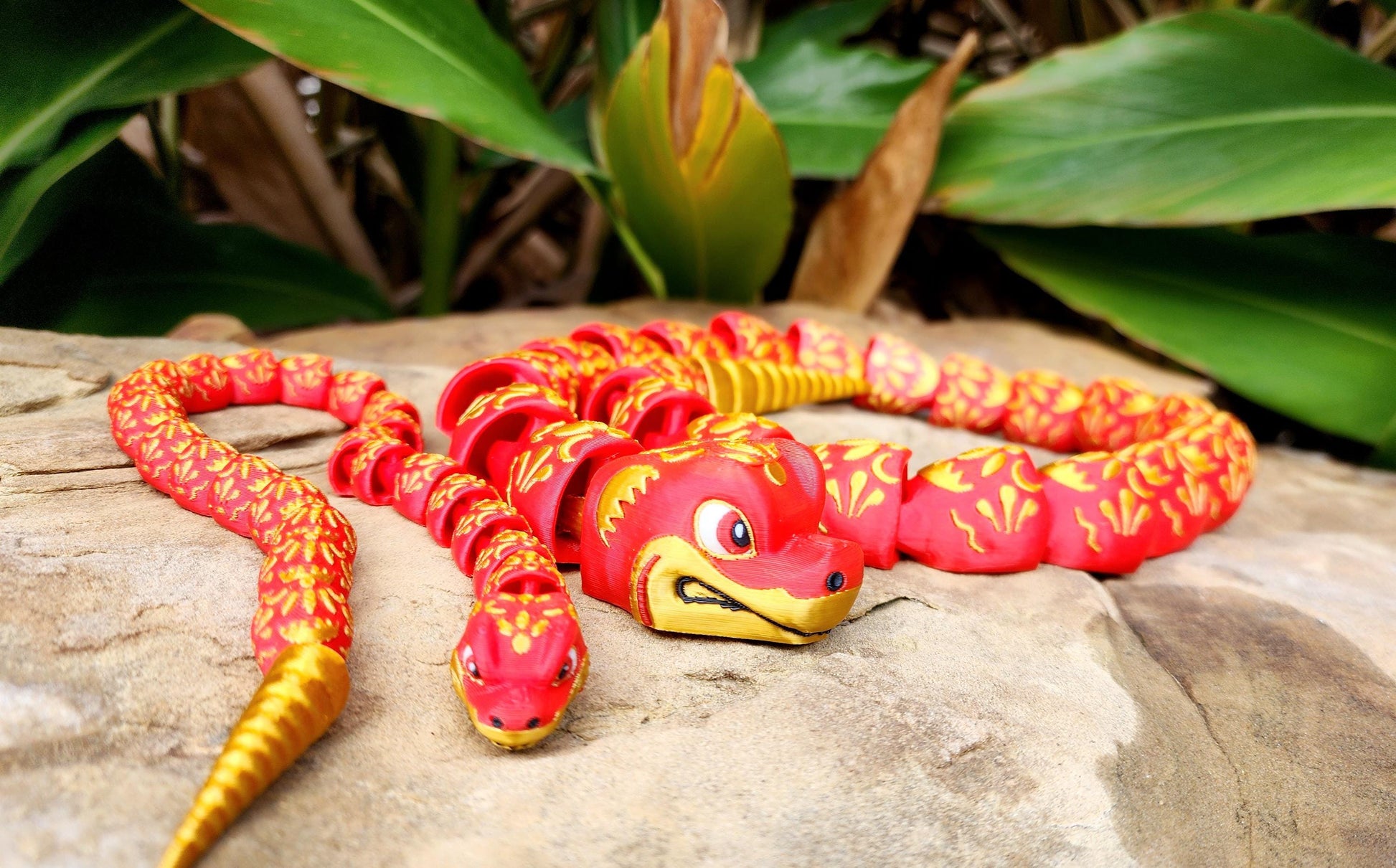 3D printed articulate Year of the Snake fidget, sensory toy.