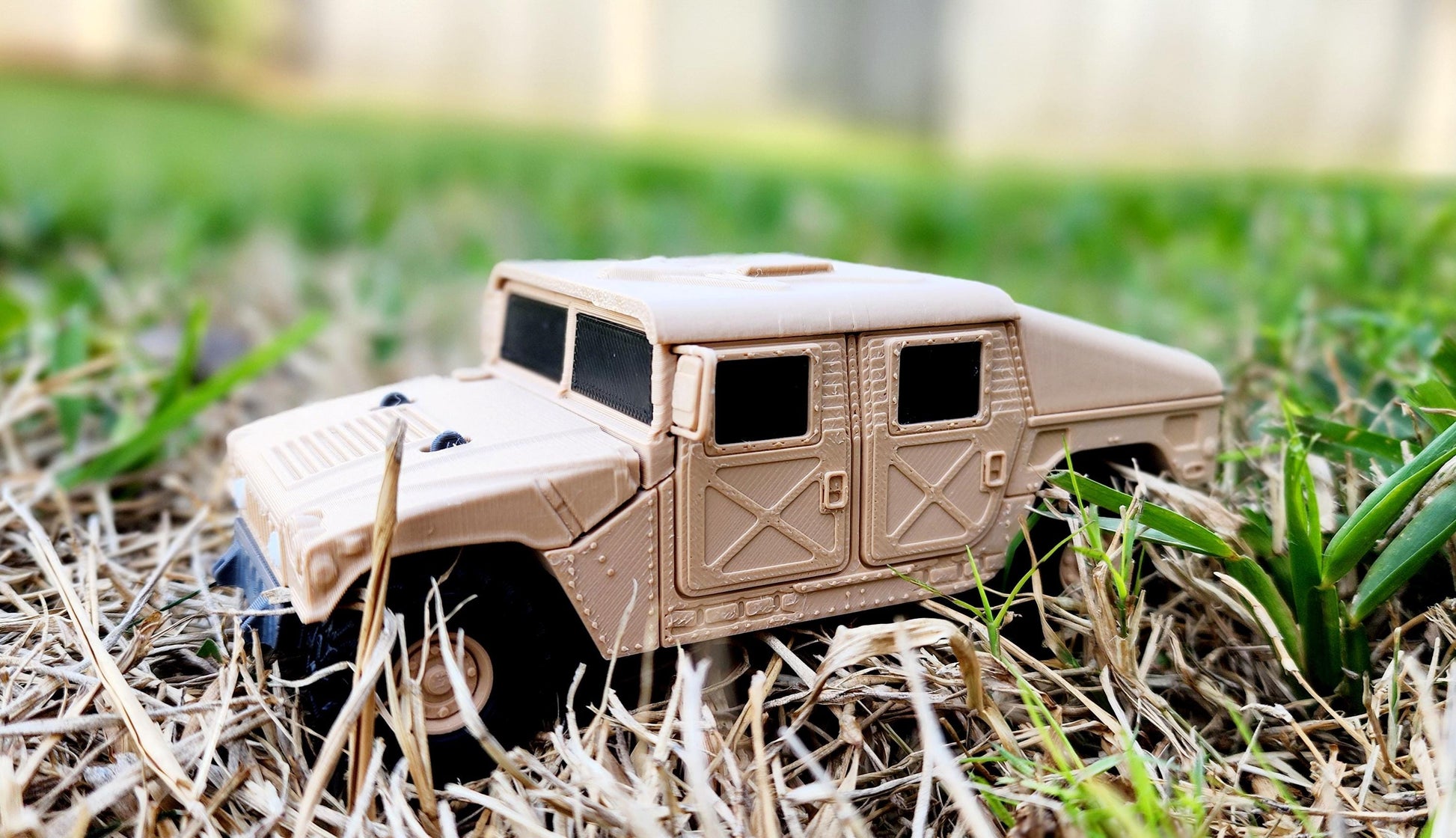 3D printed articulate Humvee action figure, fidget toy.