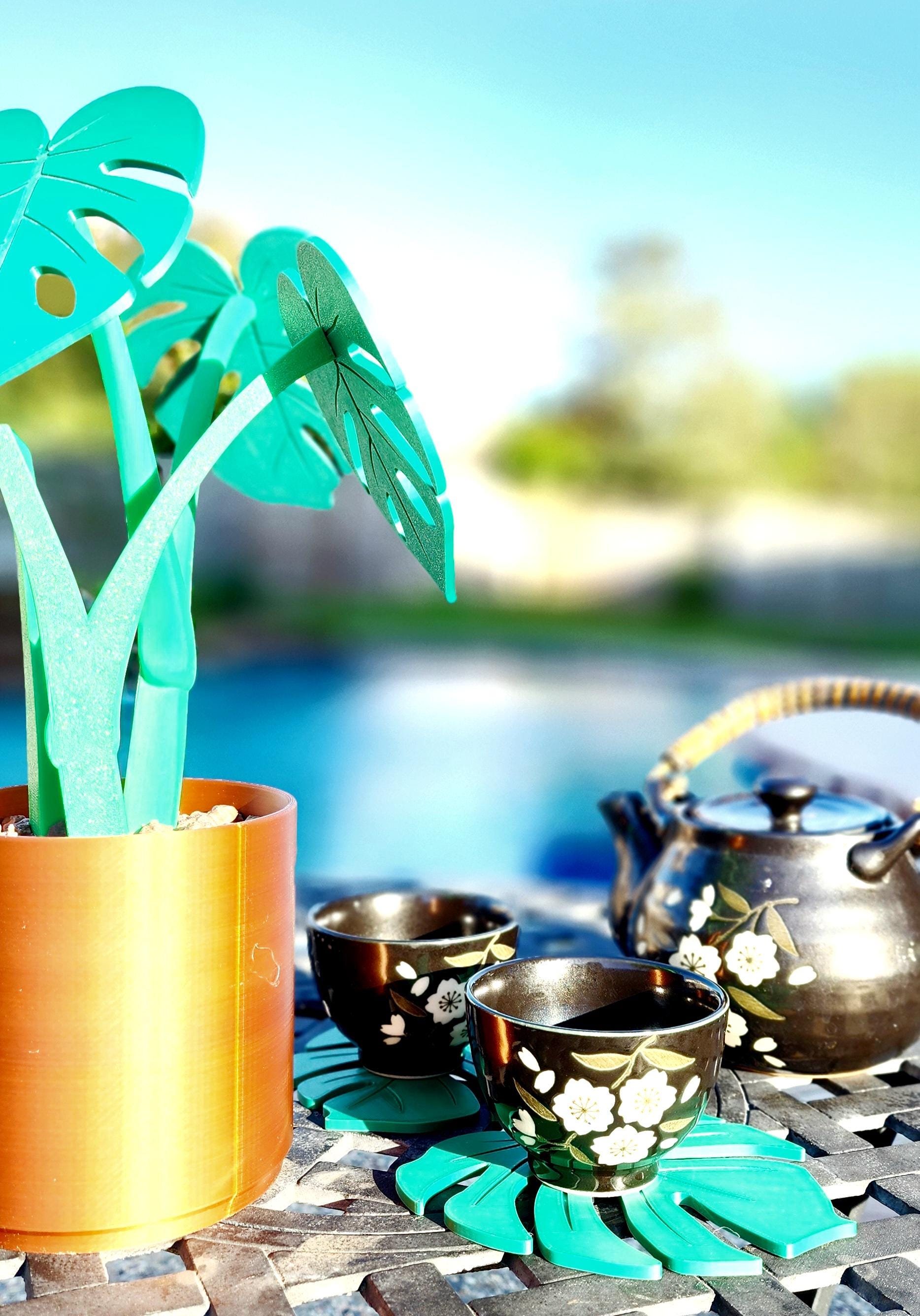 3D printed Monstera Coaster Set with optional armrest table.